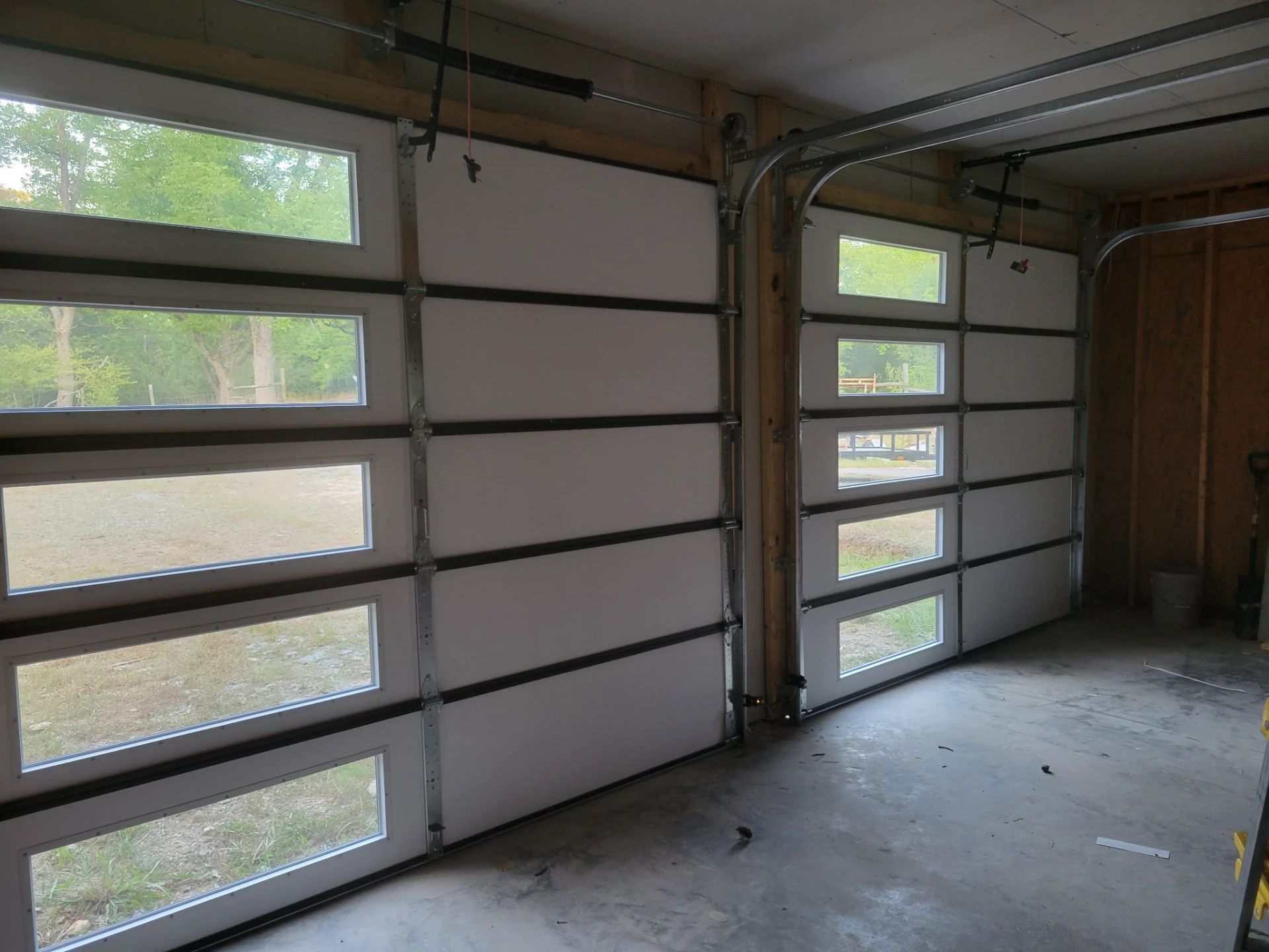 Interior view of newly installed garage doors with windows
